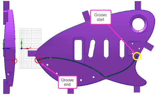 The guitar body has a 3D Contoured Groove that runs the length of the part from right to left. The yellow circle on the right shows where the groove enters and the red circle on the left shows where the groove exits the guitar body.